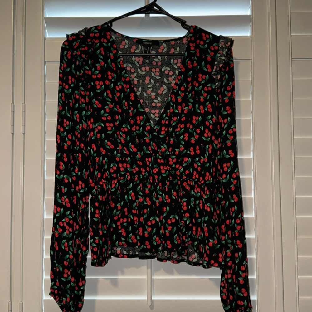 A forever 21 blouse, size Med! Long sleeve, designed with cherries all over